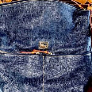 Navy Blue never been used Dooney & Burke Tote.  The tags are still attached.